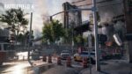 Battlefield 6 screenshot showing destroyed urban environment with construction equipment, emergency vehicles, and partially collapsed buildings under smoky sky in Brooklyn setting