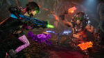 Borderlands 4 gameplay screenshot showing two Vault Hunters in combat on planet Kairos with colorful weapons and enemies in a dark cave-like environment