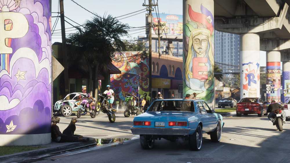 Grand Theft Auto VI official screenshot showing Vice City urban environment with neon-lit buildings and detailed street scene from Rockstar Games May 2025 release
