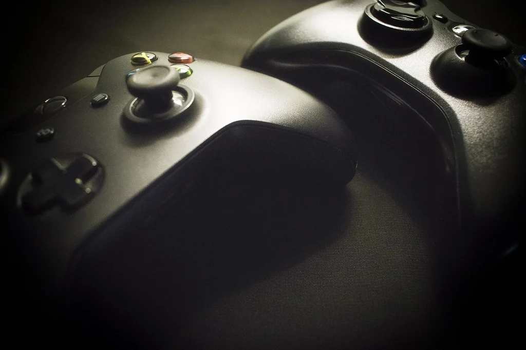 Xbox console and controller on a surface representing the Xbox Game Pass subscription service price hike debate in 2026