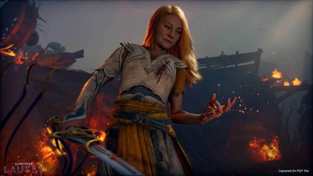 Faye, the Jötnar warrior and protagonist of God of War Laufey, stands poised for battle within the mystical Everywhen realm, surrounded by ancient magical energy on PlayStation 5